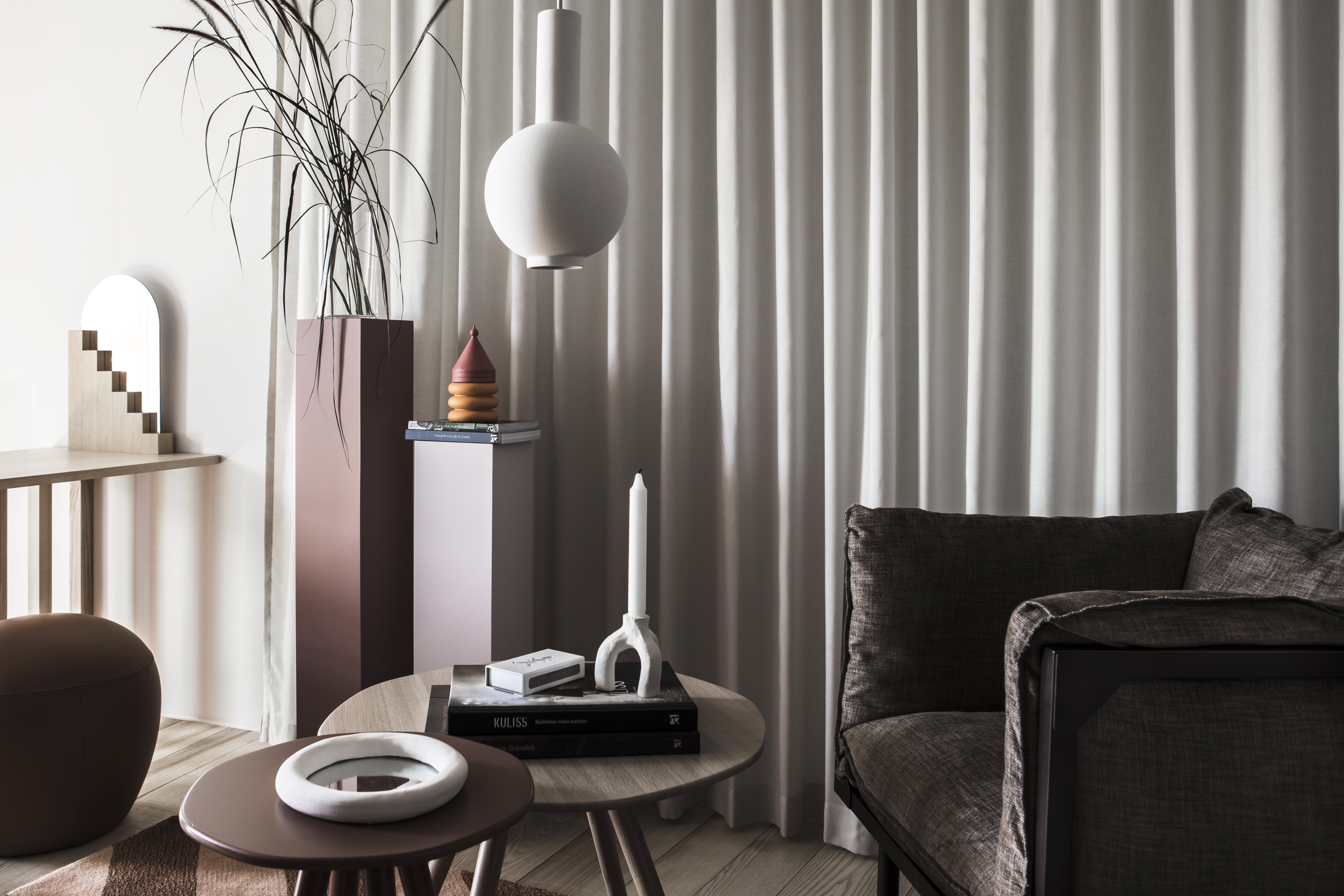 Hotel apartment environment with a sofa, coffee table, and decor