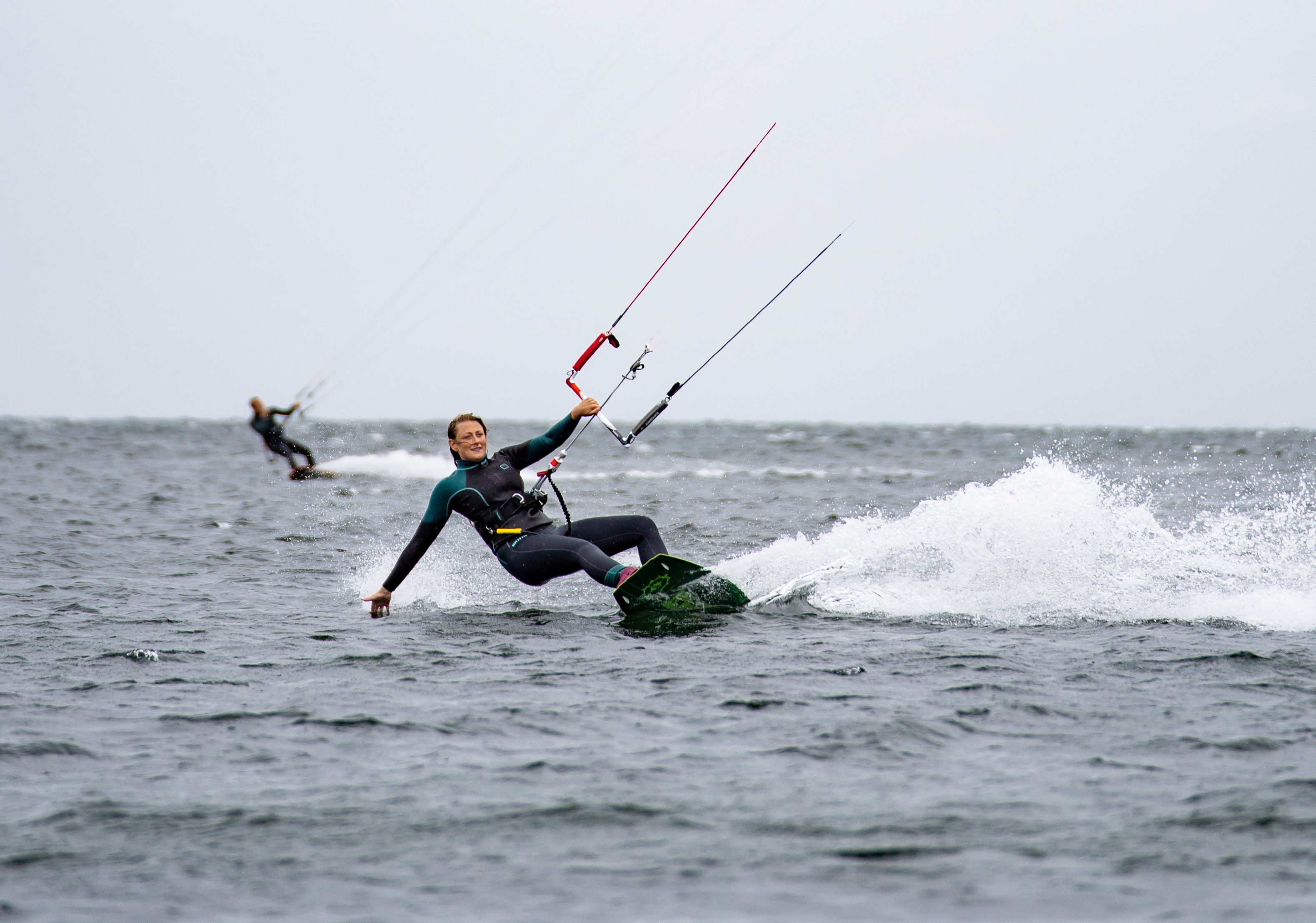 Woman kite surfing on water