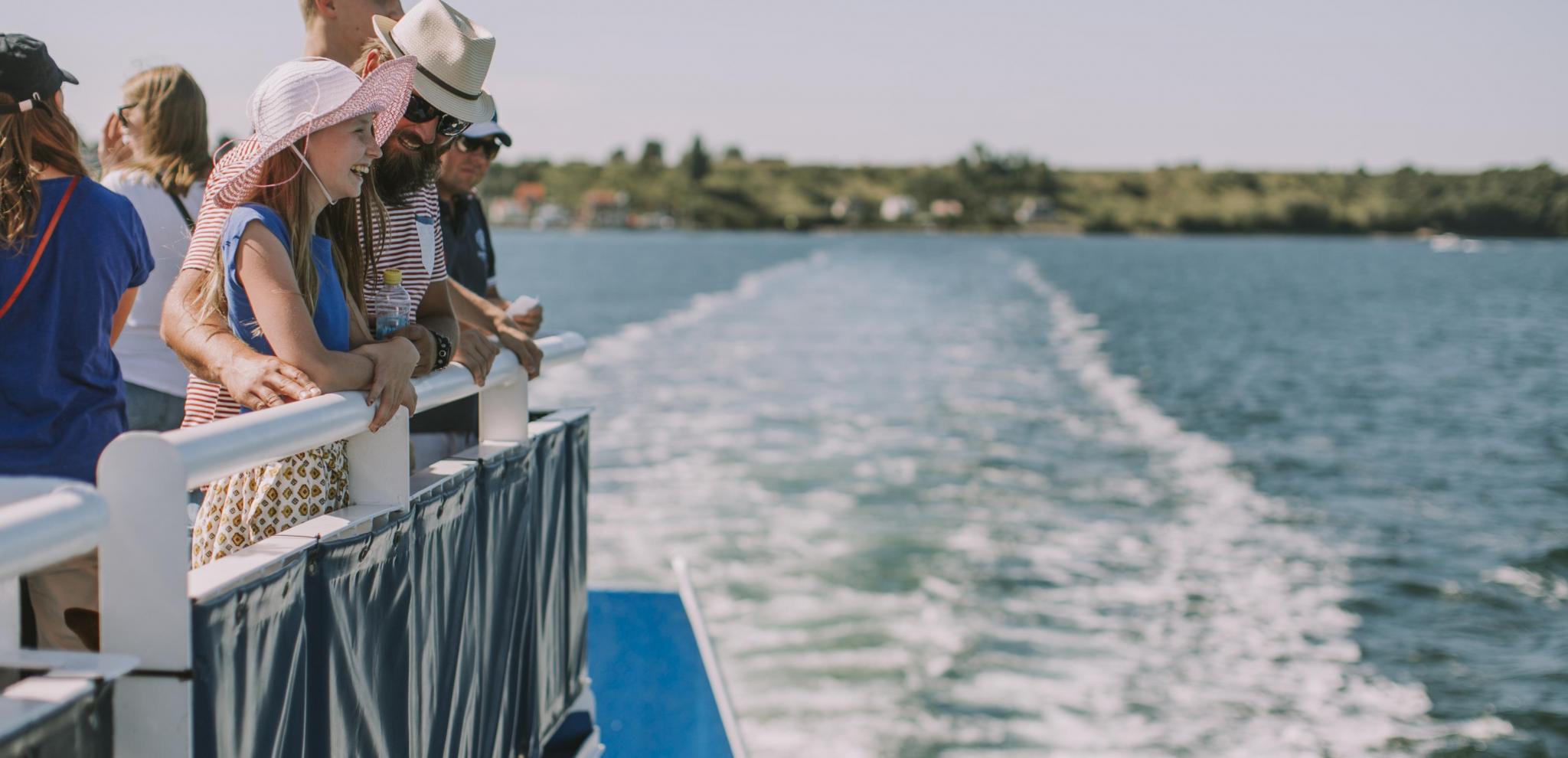Family leaving the shore on a ferry