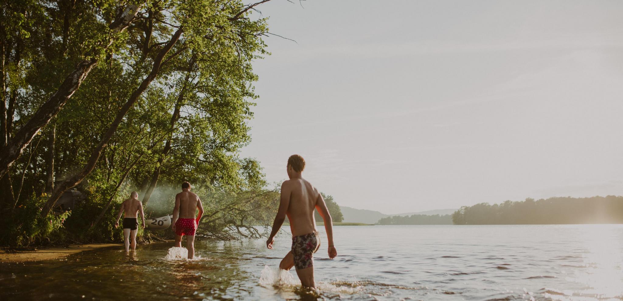 Three friends take an evening dip in Ivösjön