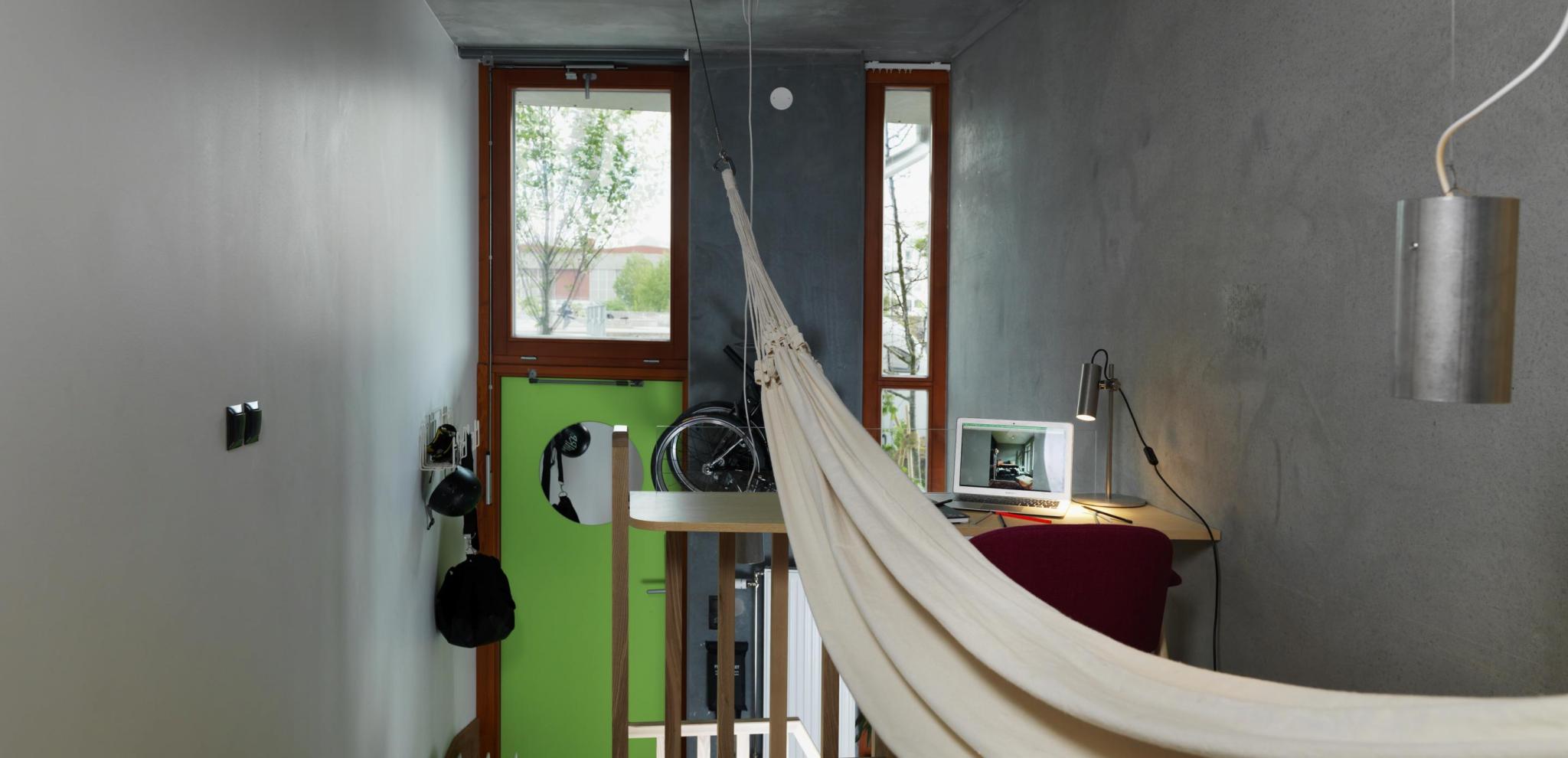 Ohboy hotel room with hammock and green door