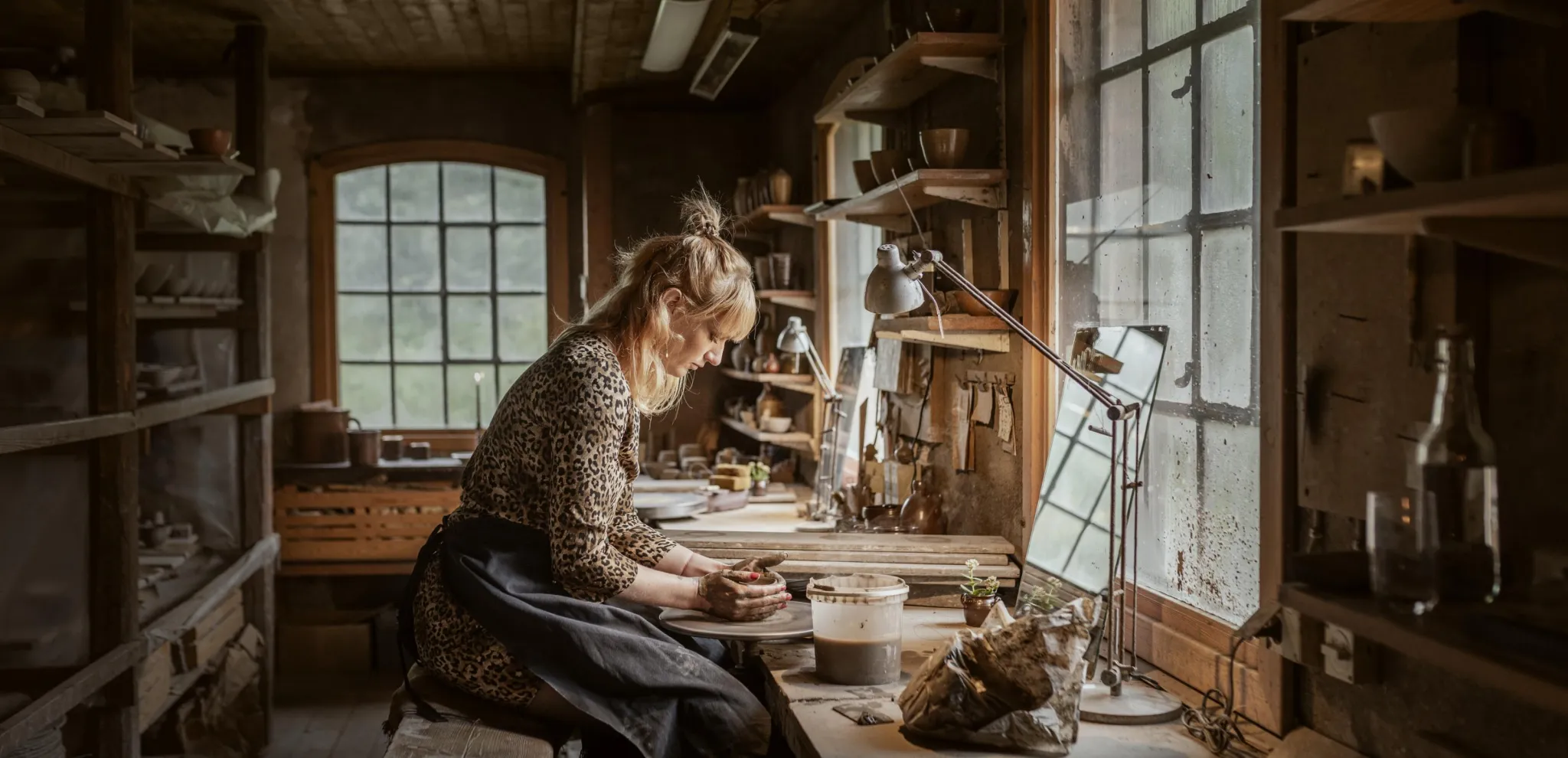  A woman turning pottery at Wallåkra Stoneware factory