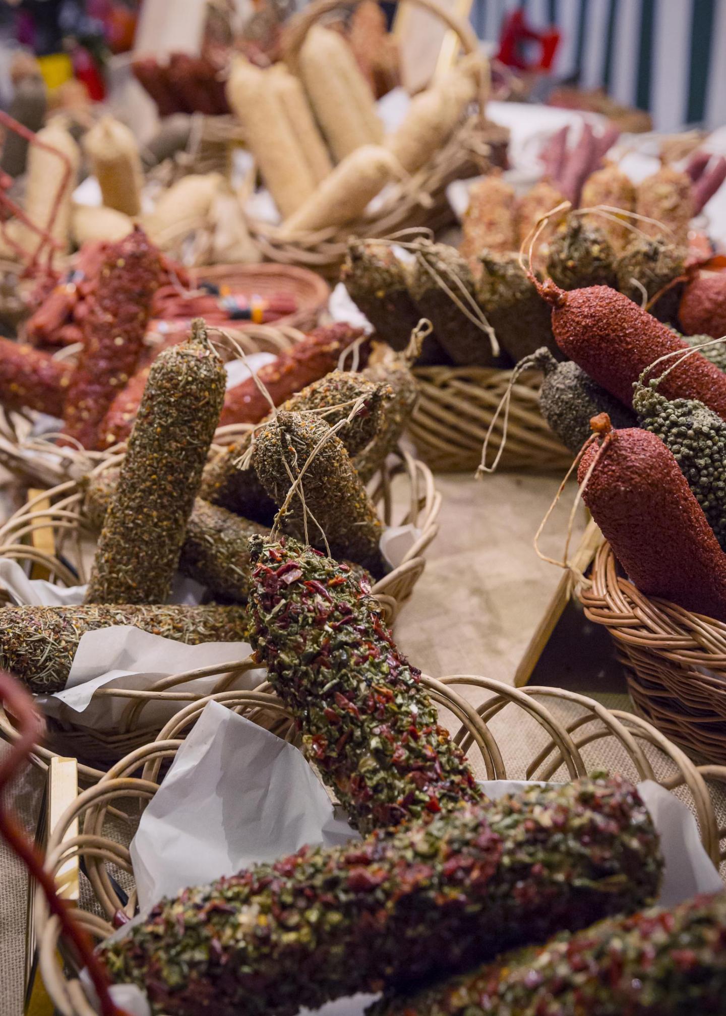 Dried sausages in woven baskets