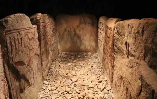 The Inside of a royal viking tomb in Kivik surrounded with rune stones