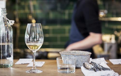 Bartop tablesetting with bartender in background cropped