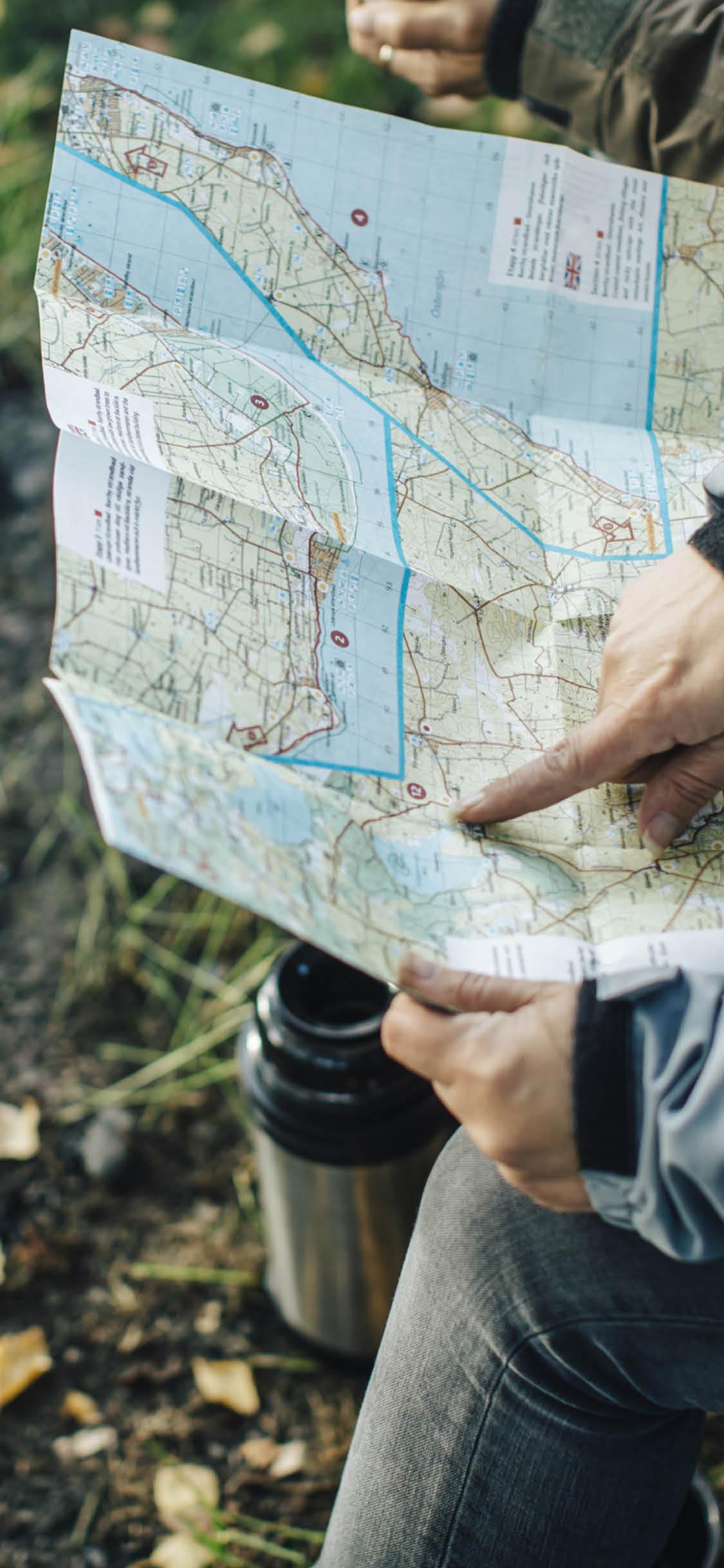 hand up close pointing at a map