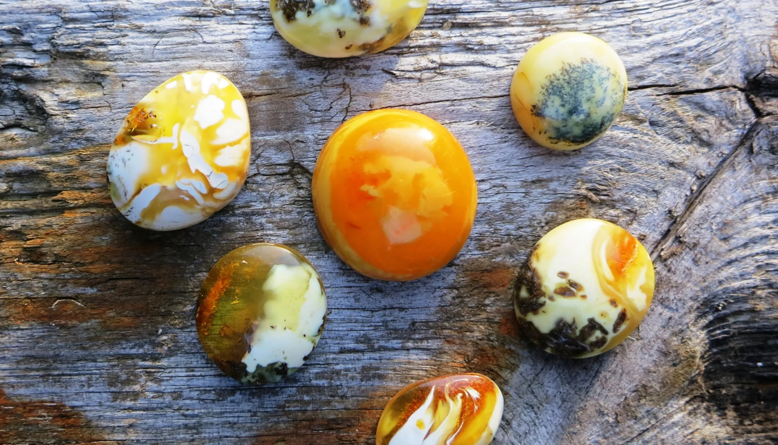 colorful Ember stones on a wooden surface 
