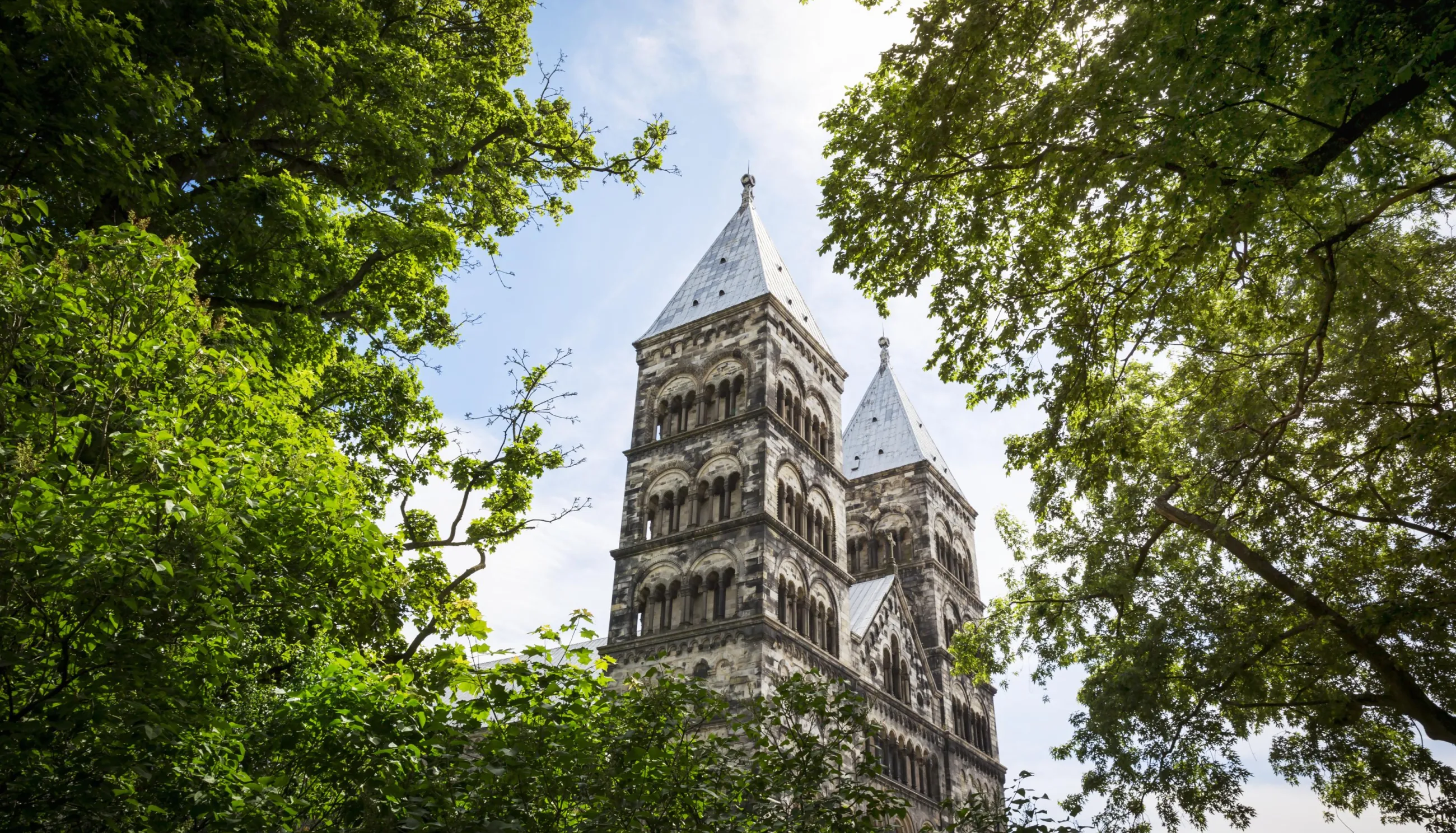 View over the Lund Cathedral through the green tree tops