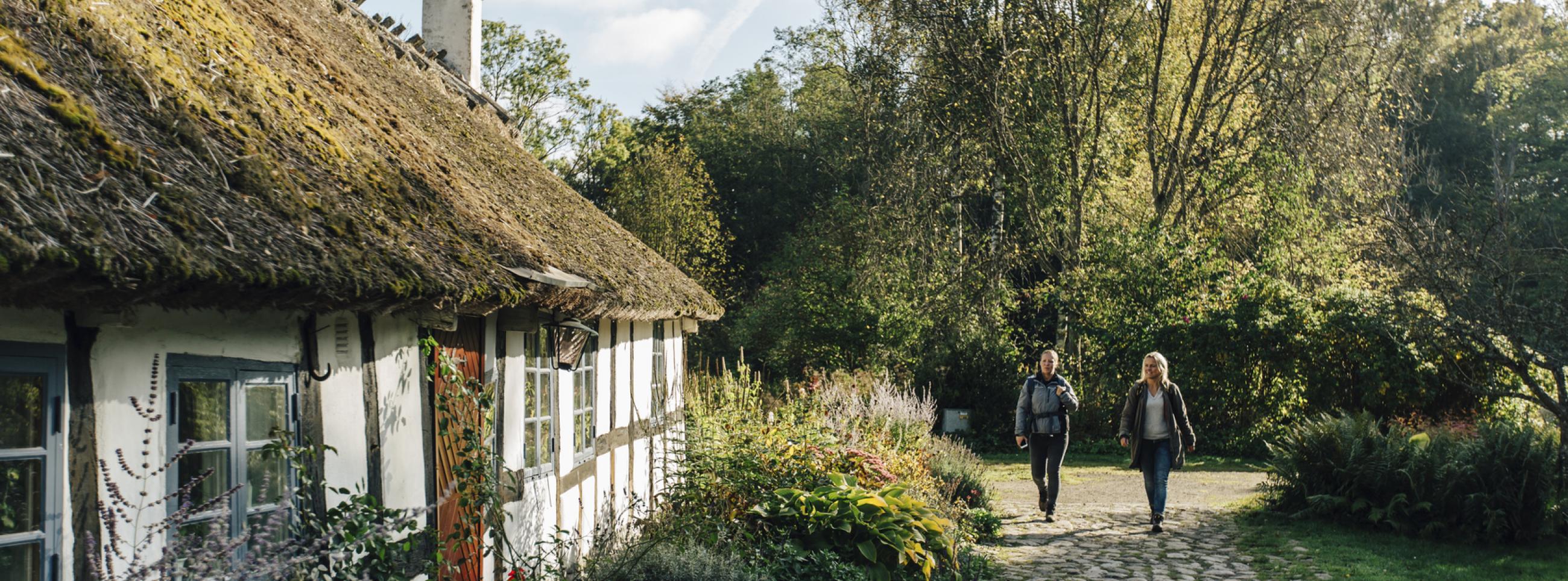 Traditional cottage with cobblestone path and garden