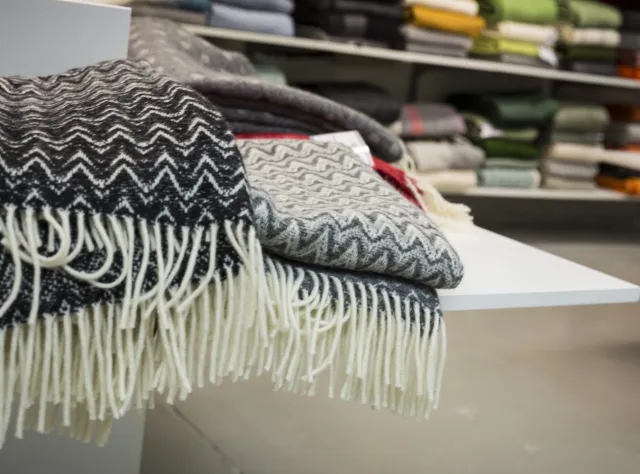 Scarves on a table inside Klippan's wool factory