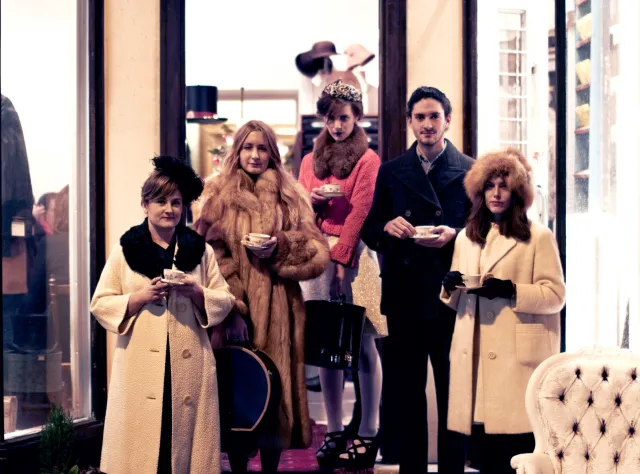Tea party with vintage coats