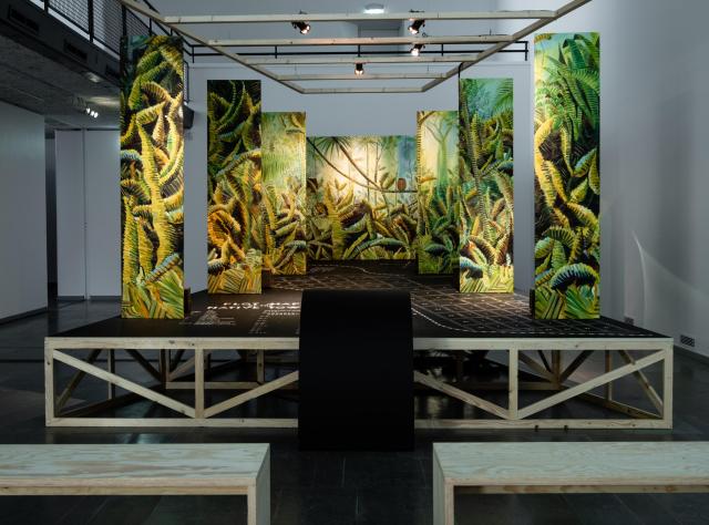 Green and yellow art installation on stage