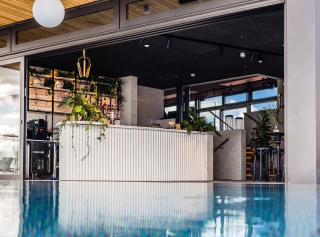 A view of a rooftop bar and a pool