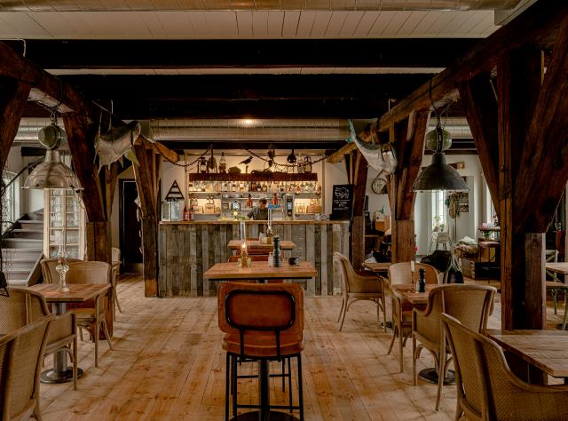 Restaurant interior with wooden floors, decorated with authentic details from an old fishing village
