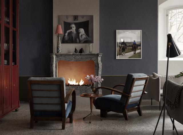 Fireplace with two armchairs positioned in front, creating a cozy lounge setting"