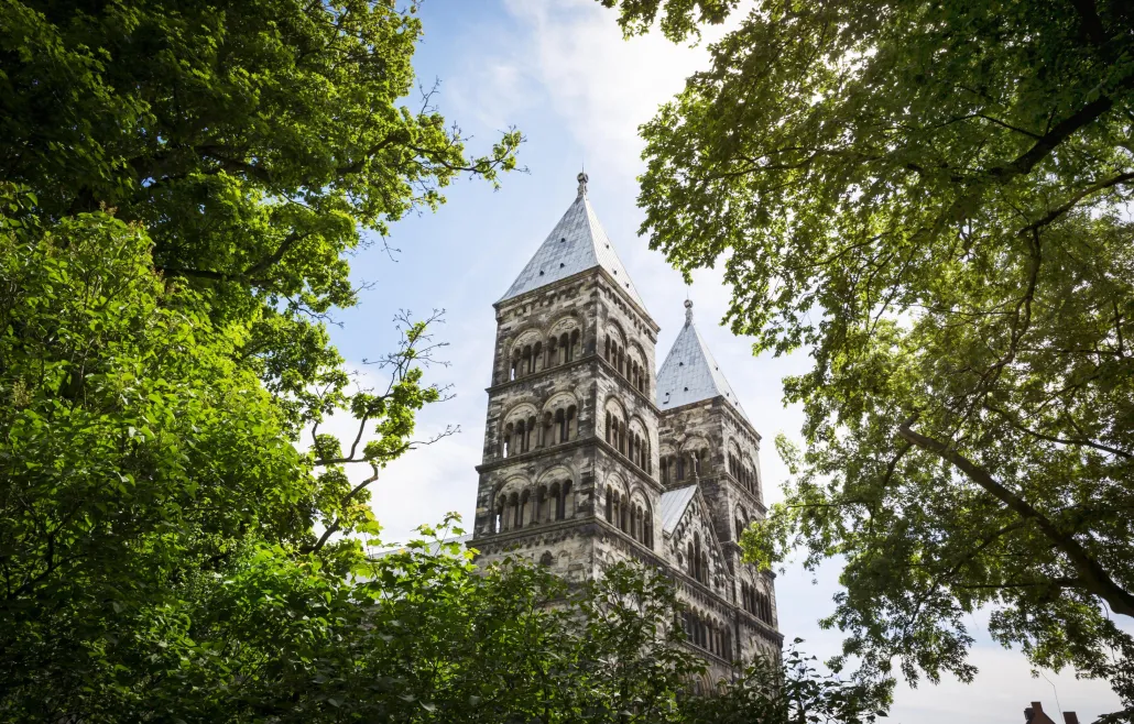 View over the Lund Cathedral through the green tree tops
