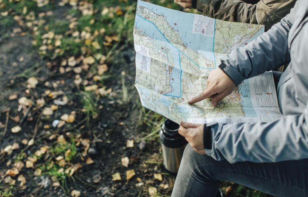 hand up close pointing at a map